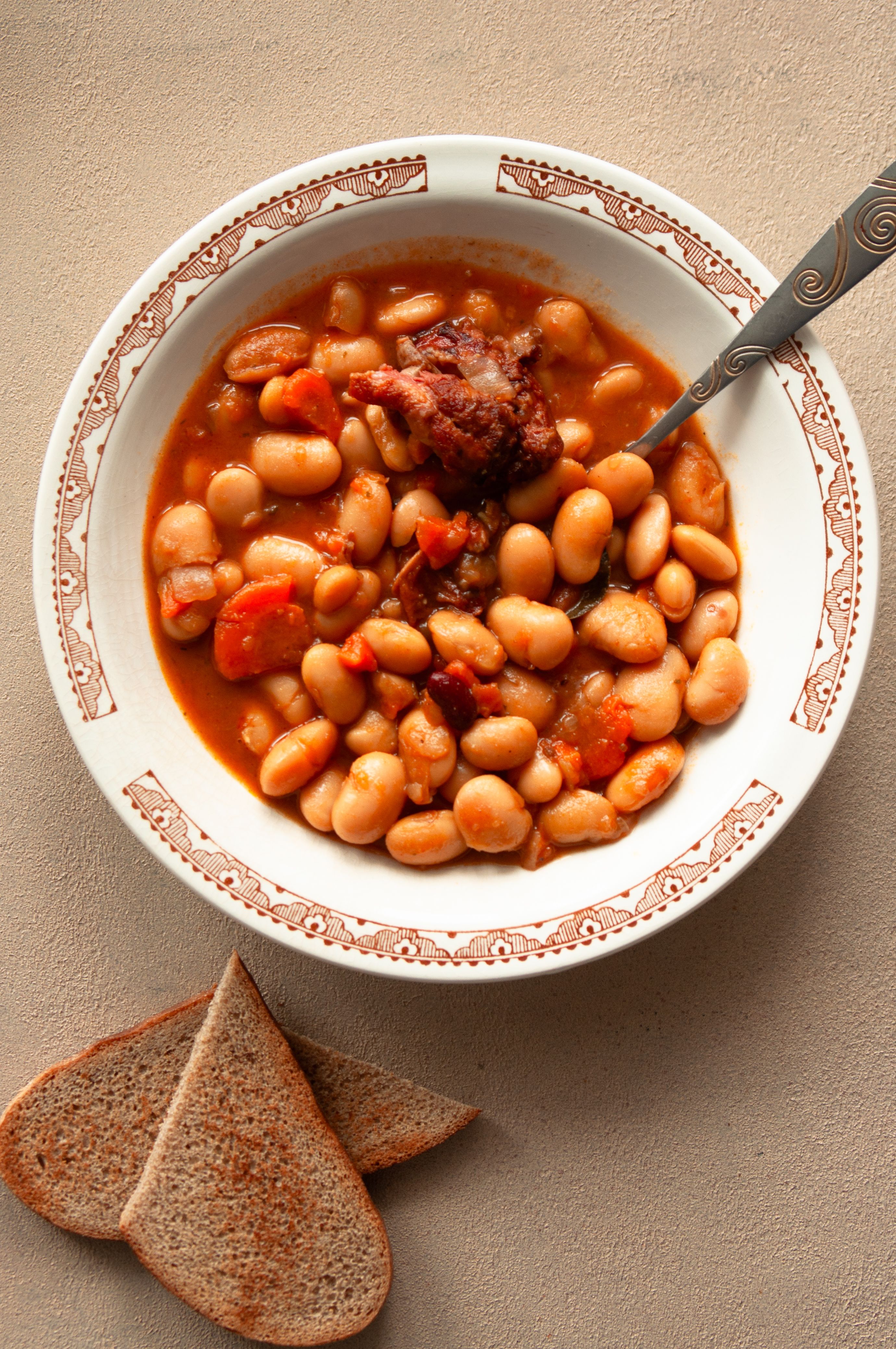 A bowl of ribollita with dark kale, cannellini beans and soaked bread